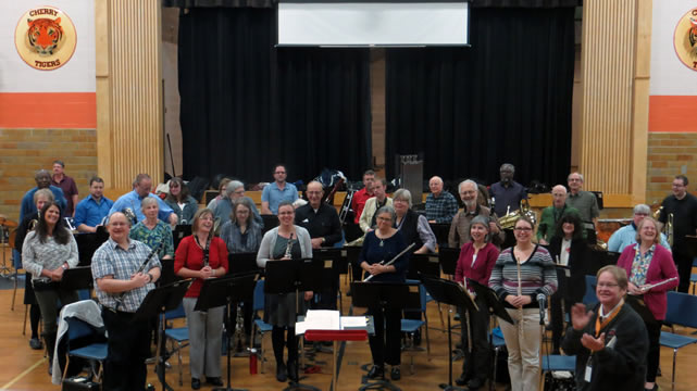 The band in a gym, standing